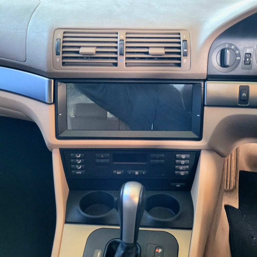 BMW E39 interior dashboard showing the Trick-Bits touchscreen display 