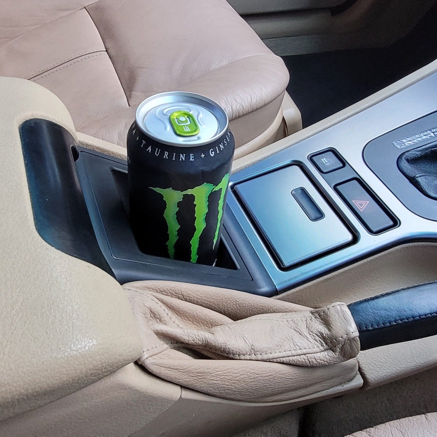 E39 Cup Holder with Monster energy drink in it